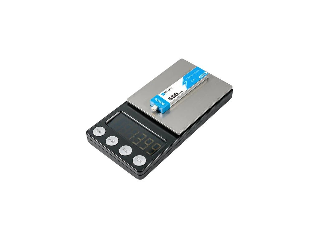 Digital scale with a 1S Betafpv battery on a white background