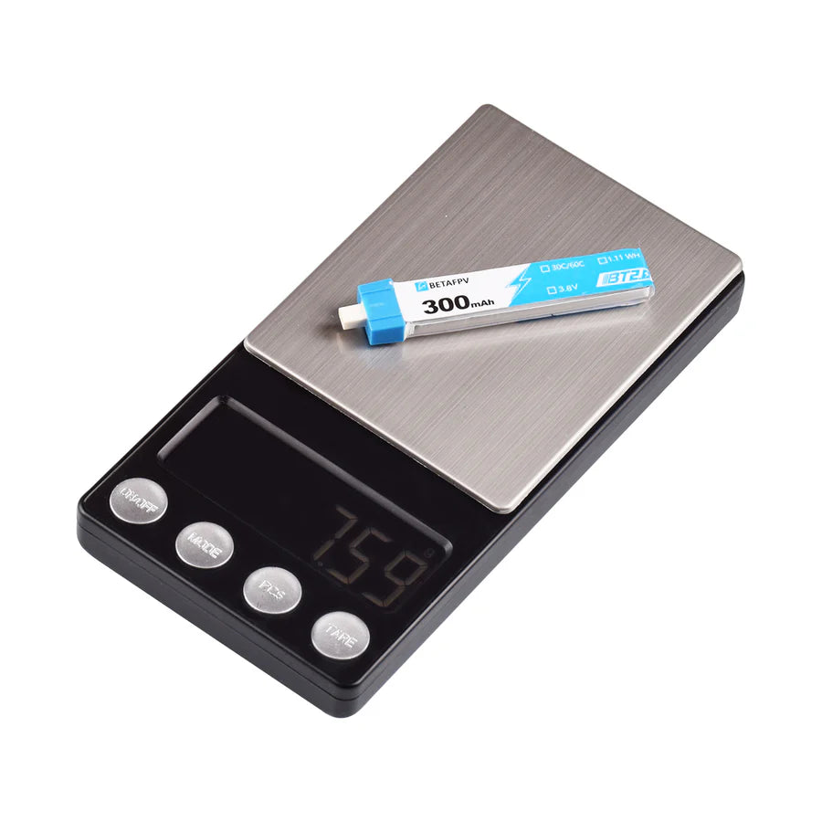 Digital pocket scale with a 1S BETAFPV battery on a white background