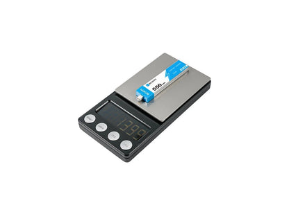 Digital scale with a 1S Betafpv battery on a white background